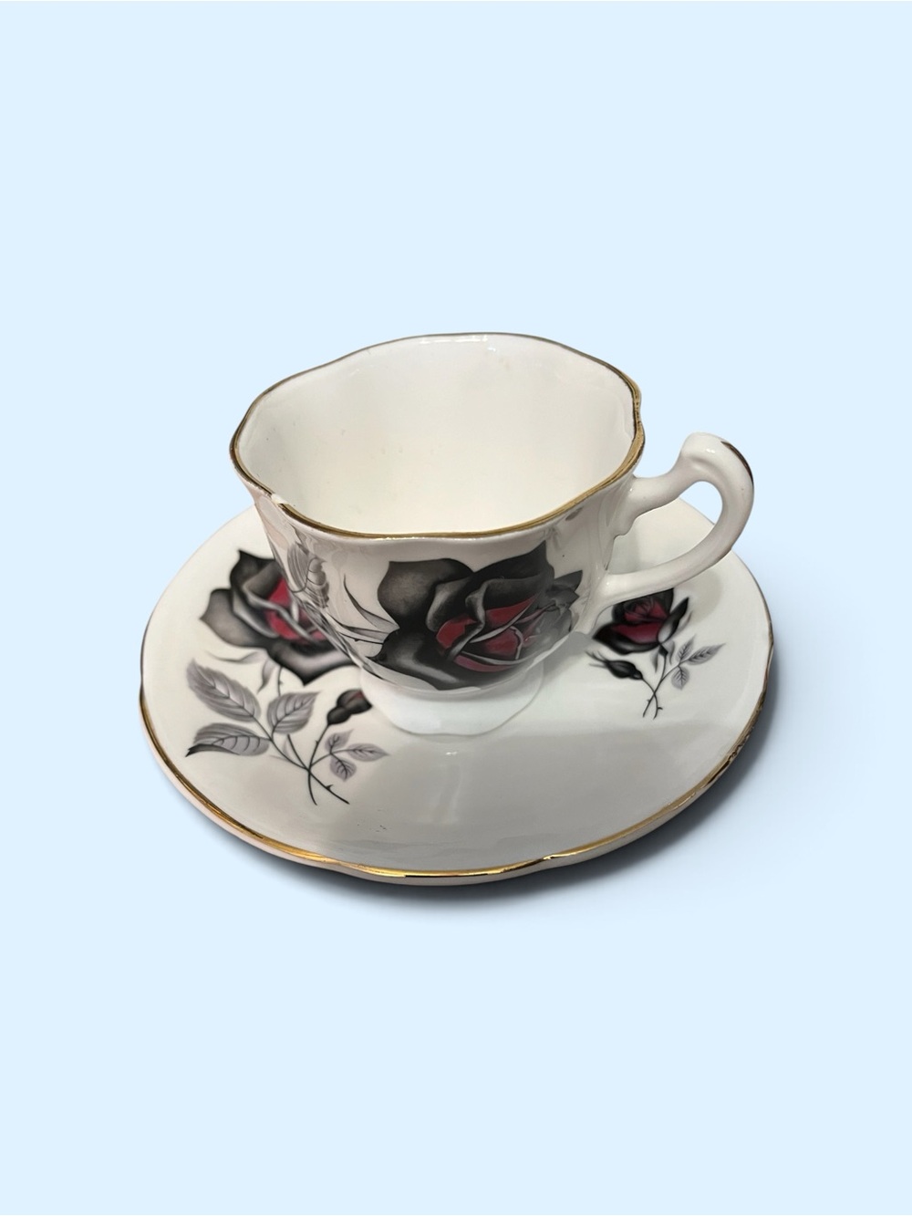 Classic White Porcelain Teacup and Saucer with Red and Black Rose Motif